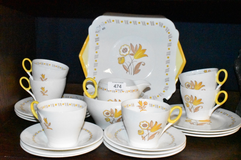 A part tea service by Shelley having yellow crocus style decoration pat no. 795072