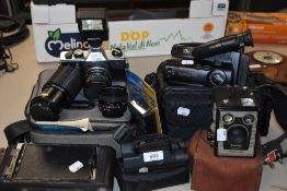 A mixed lot of vintage and retro cameras and camcorders including model D Brownie, Praktica and