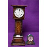 An Edwardian style miniature scale model of a long case clock and a similar version