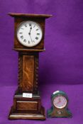 An Edwardian style miniature scale model of a long case clock and a similar version