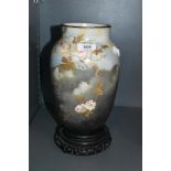 A well decorated substantial milk glass vase having rose and gilt decoration