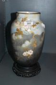 A well decorated substantial milk glass vase having rose and gilt decoration