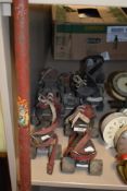 A mixed lot of vintage toys including roller skates, a truck and a pogo stick.