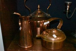 A selection of antique copper kitchen wares including barge kettle