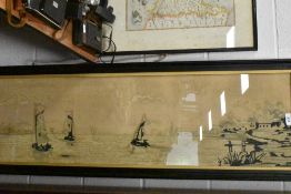 A large framed embroidery depicting seascape with windmills and houses to foreground.