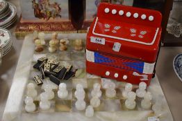 An onyx chess set,AF, vintage dominos and a toy accordion.