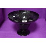 A large hand blown purple fruit or similar footed bowl 1ft accross