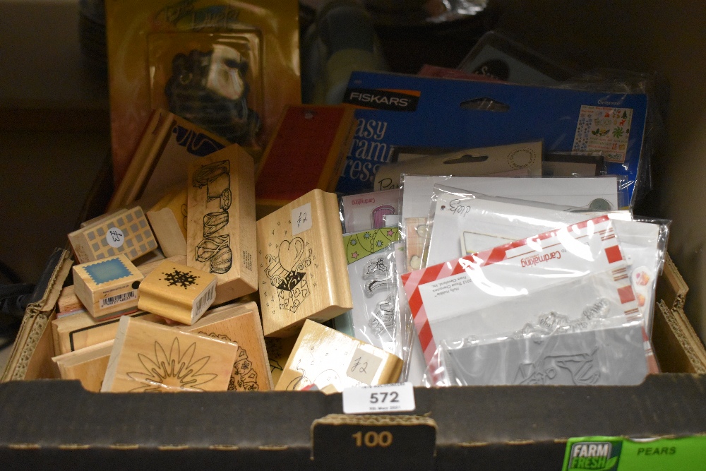 A large collection of craft items including stamps and punches.