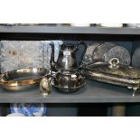 A selection of plated wares including serving mats and lidded glass lined serving dish