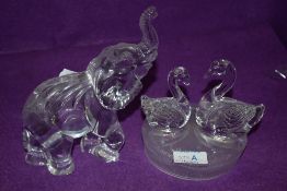 A Royal Crystal rock swan figurine and similar elephant.