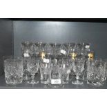 A selection of clear cut and crystal glass wares including Waterford wine glasses