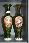 A pair of Victorian Venician style green glass vases having extensively detailed hand painted