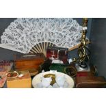A selection of curios and decorations including brass twist stem lamp base Ilford camera and trinket