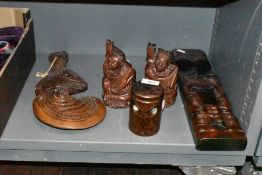 A selection of tribal and ethnic wooden carved items including ceremonial club