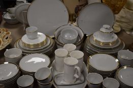A large part tea and dinner service comprising of several different makers all in a white and gilt