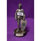 A Vintage table top cigarette lighter of a medieval knight with heavy weighted base