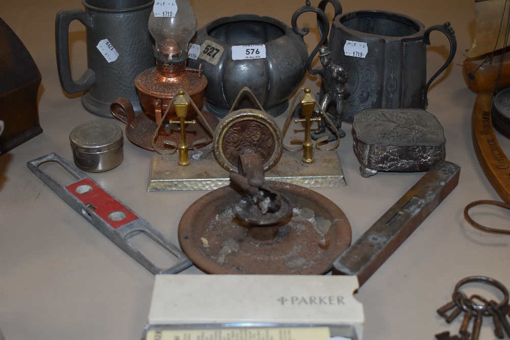 A selection of vintage items including primitive candle holder, spirit levels, letter rack and