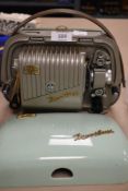 A vintage Zeiss Ikon super eight Movielux projector having mint green case.