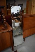 A vintage frameless cheval mirror, and dansette style ebonised legs, height approx 129cm