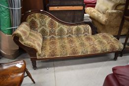 A Victorian mahogany chaise longue