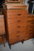 A Vintage teak and laminate tall bedroom chest of six drawers on stylised legs