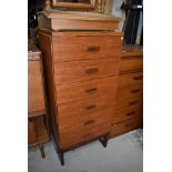 A Vintage teak and laminate tall bedroom chest of six drawers on stylised legs