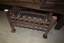 A cast iron fire grate or insert for inglenook