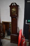 A long cased clock having brass dial and reading Tempus , of small proportions