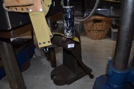 A heavy set industrial cast iron press