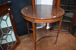 A tea table having fluted legs under veneer mahogany flame top