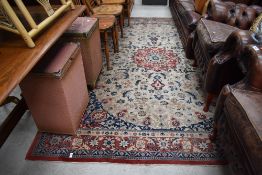 A room sized carpet square having cream russett and blue ground