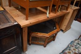 A natural pine kitchen dining table, on chunky square legs