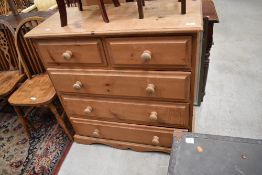 A natural pine chest of two over three drawers , having tongue and groove drawer bottoms