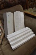 A selection of painted white wood display shelves