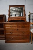 A late Victorian stained Ash chest of two over two drawers having mirrored dressing table back 100cm