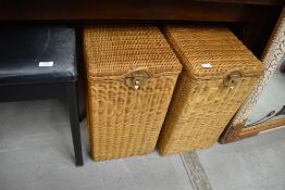 A pair of slim wicker lined linen or blanket boxes