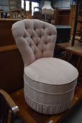 A vintage button back nursing chair