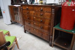 A 19th Century flame mahogany Scotch style chest of two over four drawers, having turned wood