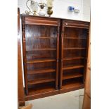 A pair of oriental hardwood open bookshelves, having concealed upper drawer