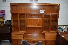 A mid century design wall unit by Nathan having glazed display shelving 190cm long