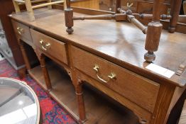 A golden oak craftsman made dresser in the vernacular style having pegged joints, ledge back,