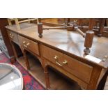 A golden oak craftsman made dresser in the vernacular style having pegged joints, ledge back,