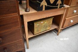 A utility or similar kitchen table in stripped pine