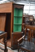 A reproduction Regency style mahogany corner display with open shelves over cupboard, height approx.