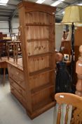 A natural pine shallow book case, height approx. 183cm