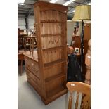 A natural pine shallow book case, height approx. 183cm