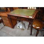 A Victorian mahogany desk having later skiver top, frieze drawers, with dummy drawers on reverse, on