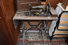 A vintage treadle sewing machine, Jones medium