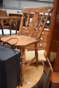 A traditional kitchen chair having elm back