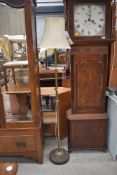 An early 20th Century standard lamp having wood base and brass column